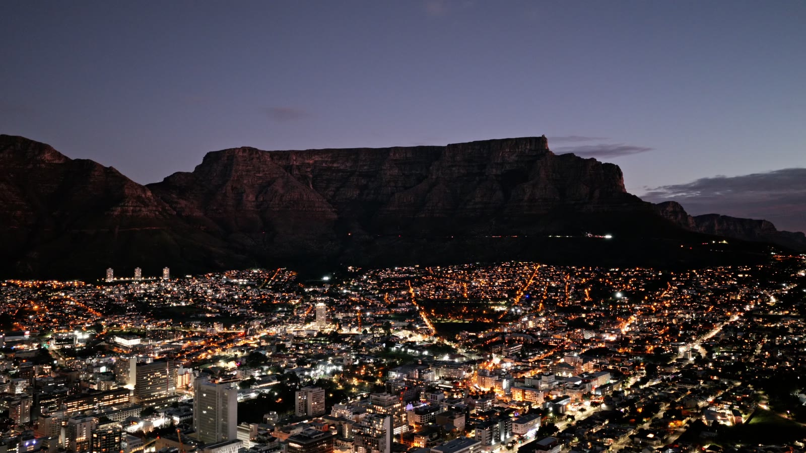 Cape Town at night from above, the city lights below Table Mountain