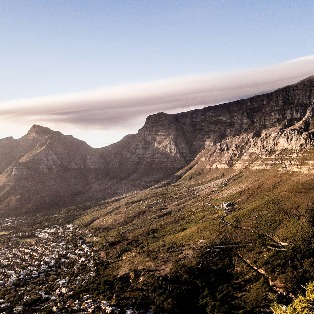 Table Mountain and the Twelve Apostles under morning cloud, the city below